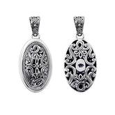 Handcrafted sterling silver oval pendant with Bali carving design, artisan necklace.